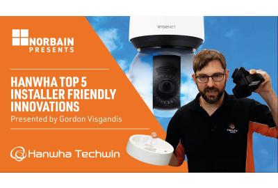 Gordon from Hanwha holding a wisenet camera with a spliced ornage background with the left saying Hanwha's top tips for installers and the other being a camera 